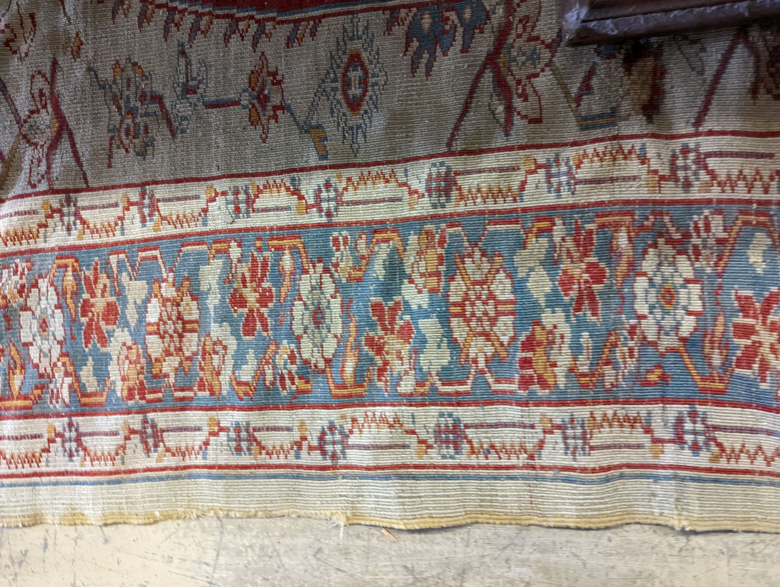 An antique Turkish? ivory ground rug, 218 cm long, 145 cm wide
